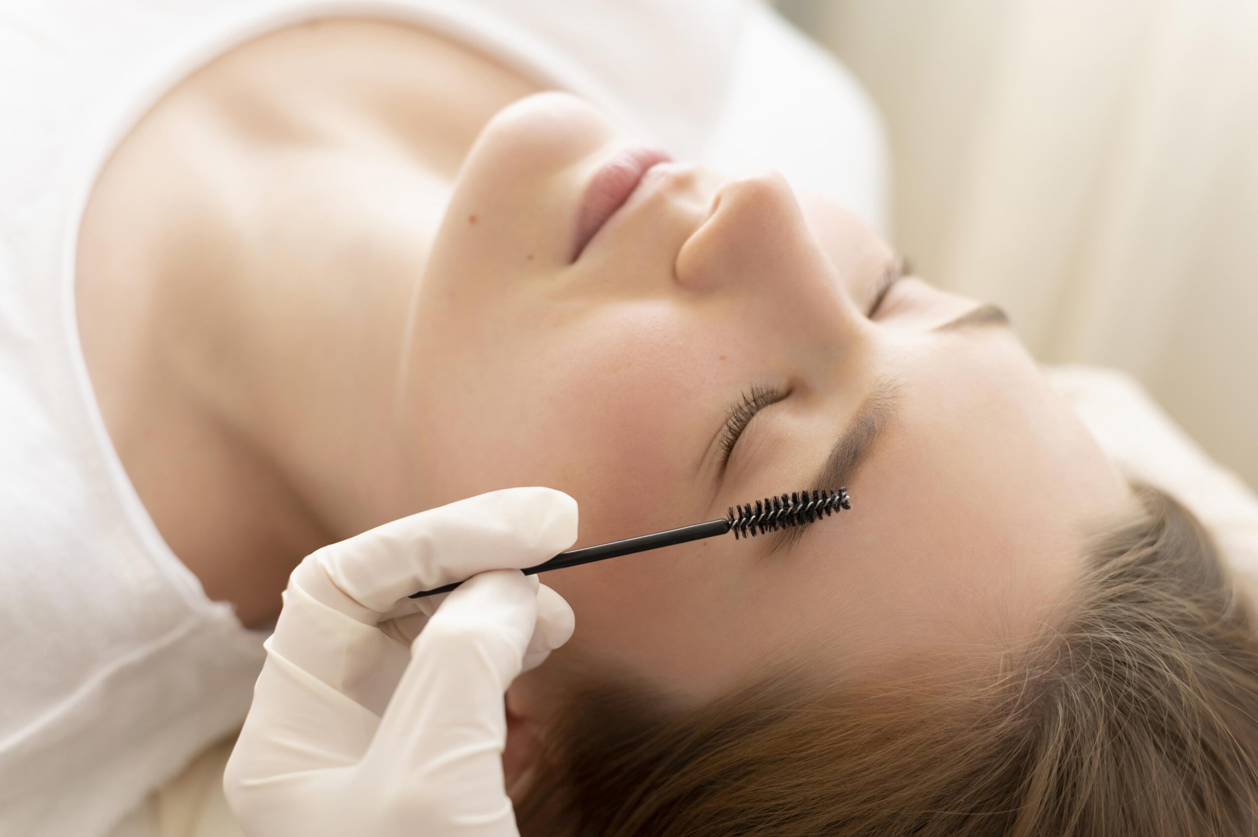 woman-getting-eyebrow-treatment Lashes & Brows